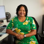 RSJI Division Director at SOCR, Denise Daniels sitting in her office.
