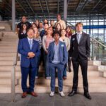 Mayor Bruce Harrell, Seattle Office for Civil Rights Director, Derrick Wheeler-Smith, SOCR Policy staff, and YCEP participants stand on City Hall steps